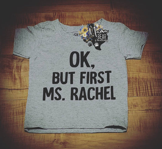 “OK, But First Ms. Rachel” Women’s Graphic Tee – Funny Mom Life T-Shirt for YouTube Toddler Moms